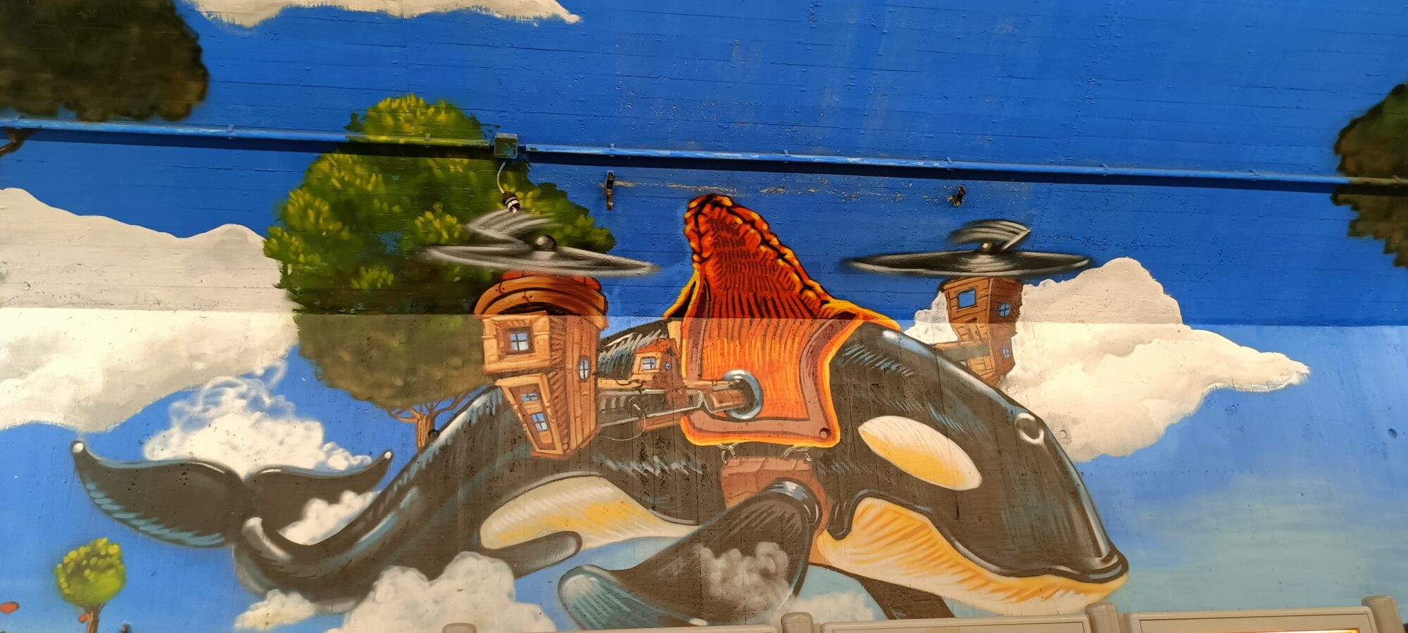 Orque volante chargée de maisons — Street art de Goodlack Art à Köln