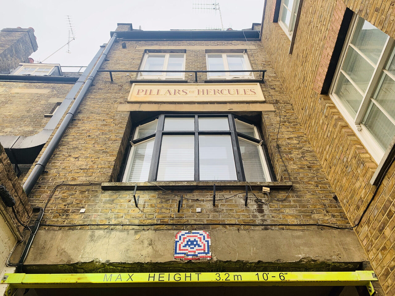 LDN_67, Space Invader on 6 Greek Street — Street art by Invader in London