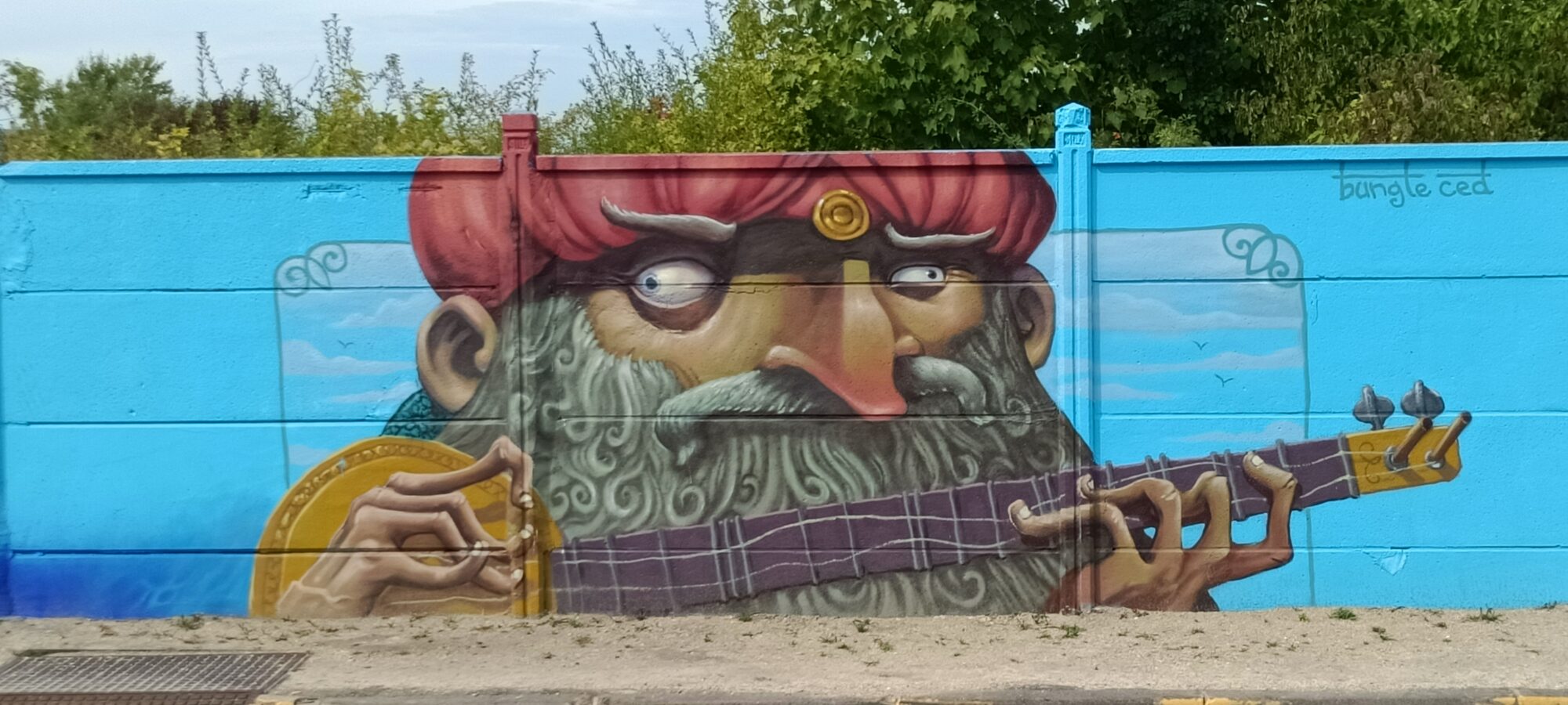 Turbaned Sitar Player by Bungle Ced — Street art in Reims