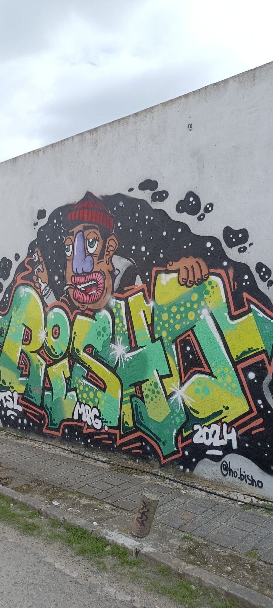 Green and Yellow Lettering with Beanie Man — Street art by Bisho in Almada