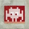 TLS_07, Crimson Alien on Red — Street art by Invader in Toulouse