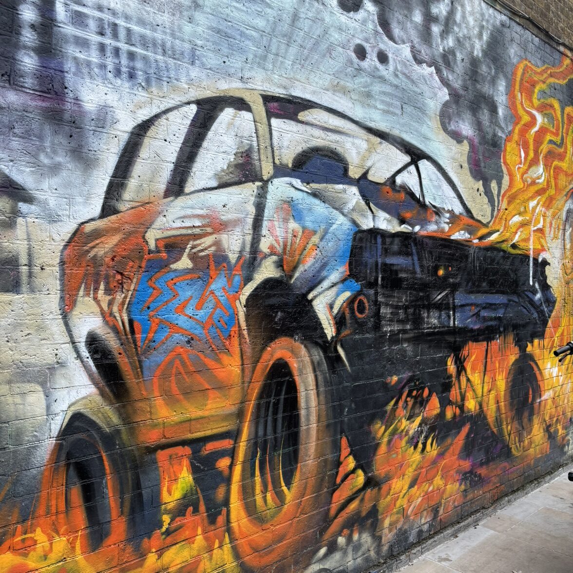 Burning Car on Whitewashed Brick — Street art in London