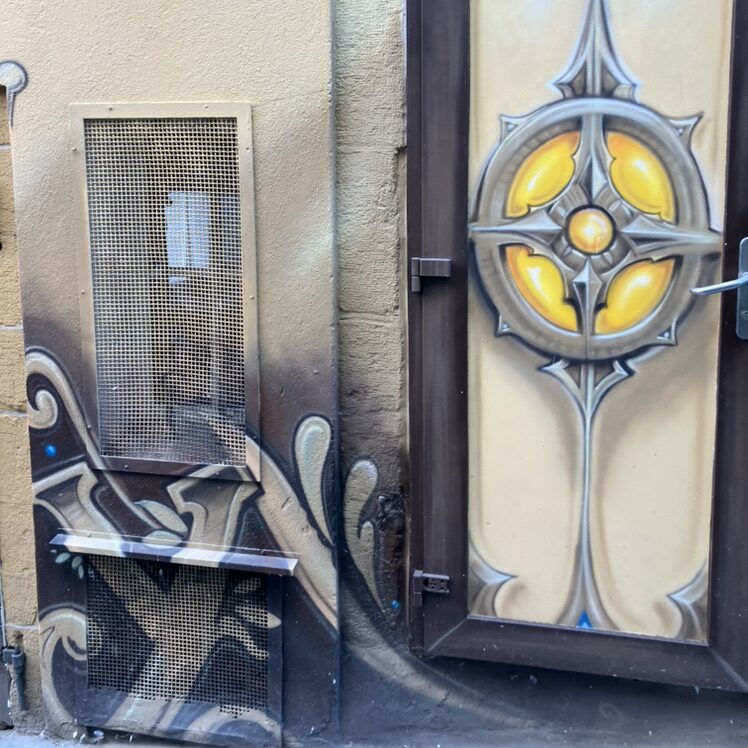 Golden Rosette on a Door — Street art in Neuchâtel