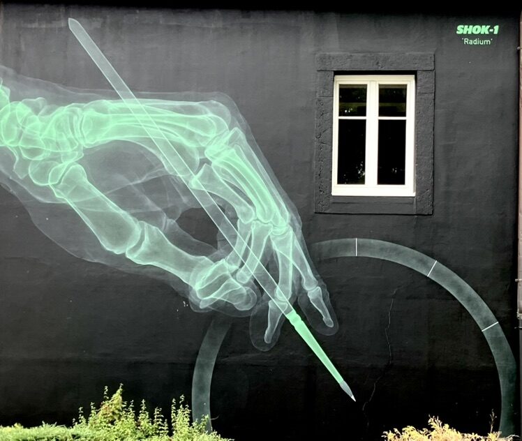Radium — Street art by SHOK-1 in Le Locle