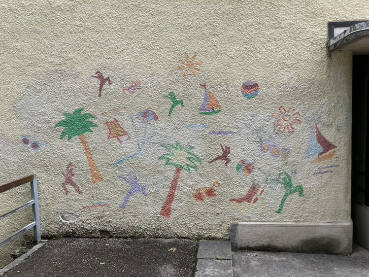 Faded Beach Scene on Rue du Progrès — Street art in La Chaux-de-Fonds