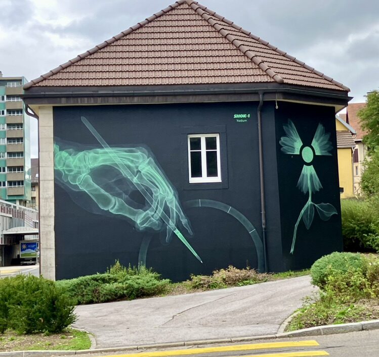 Radium — Street art by SHOK-1 in Le Locle