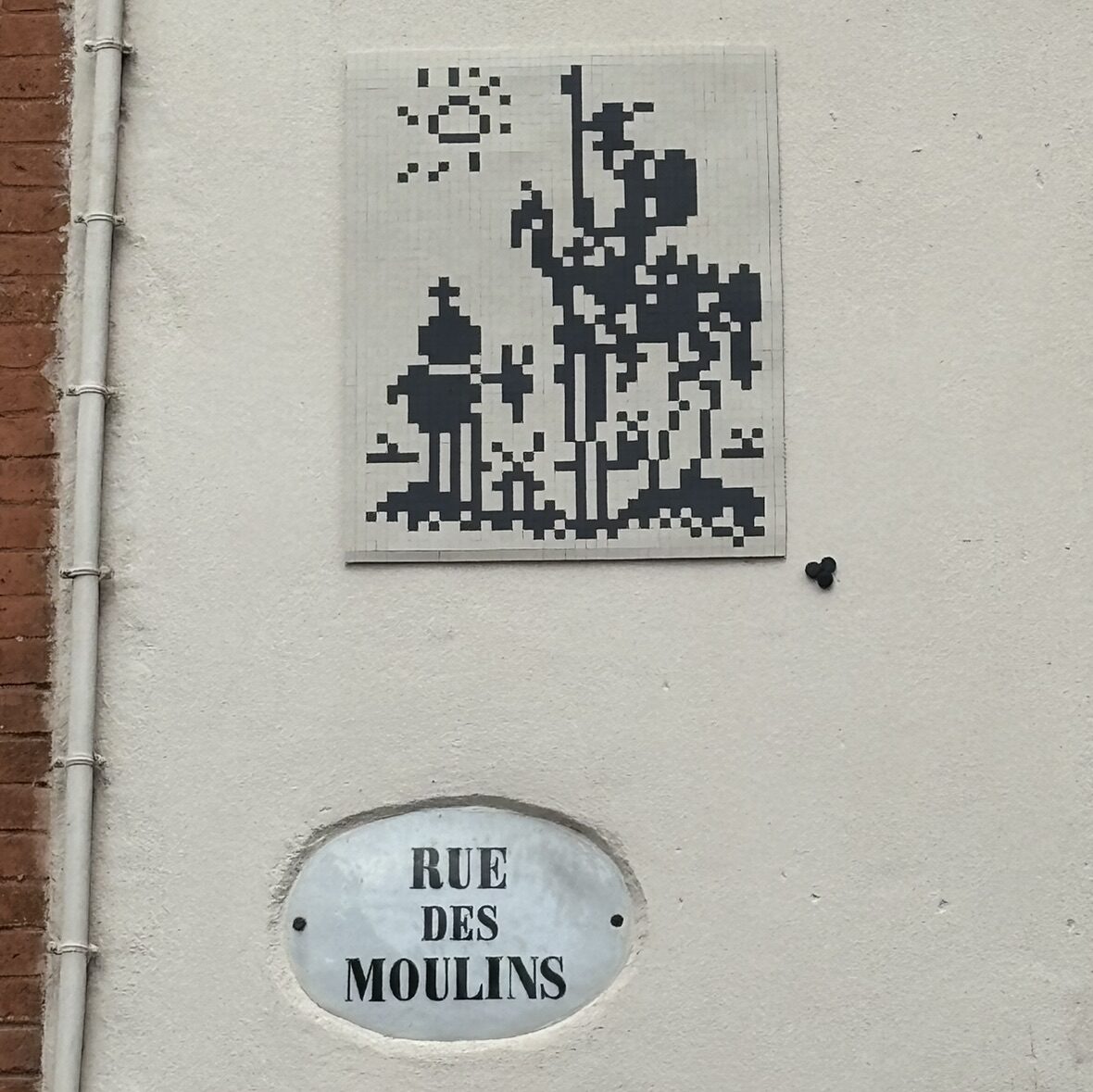 Windmill and Figure on Rue des Moulins — Street art by Mifamosa in Toulouse