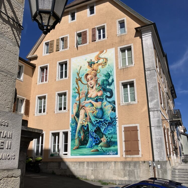 Agnès and the triton — Street art by Abys in Le Locle