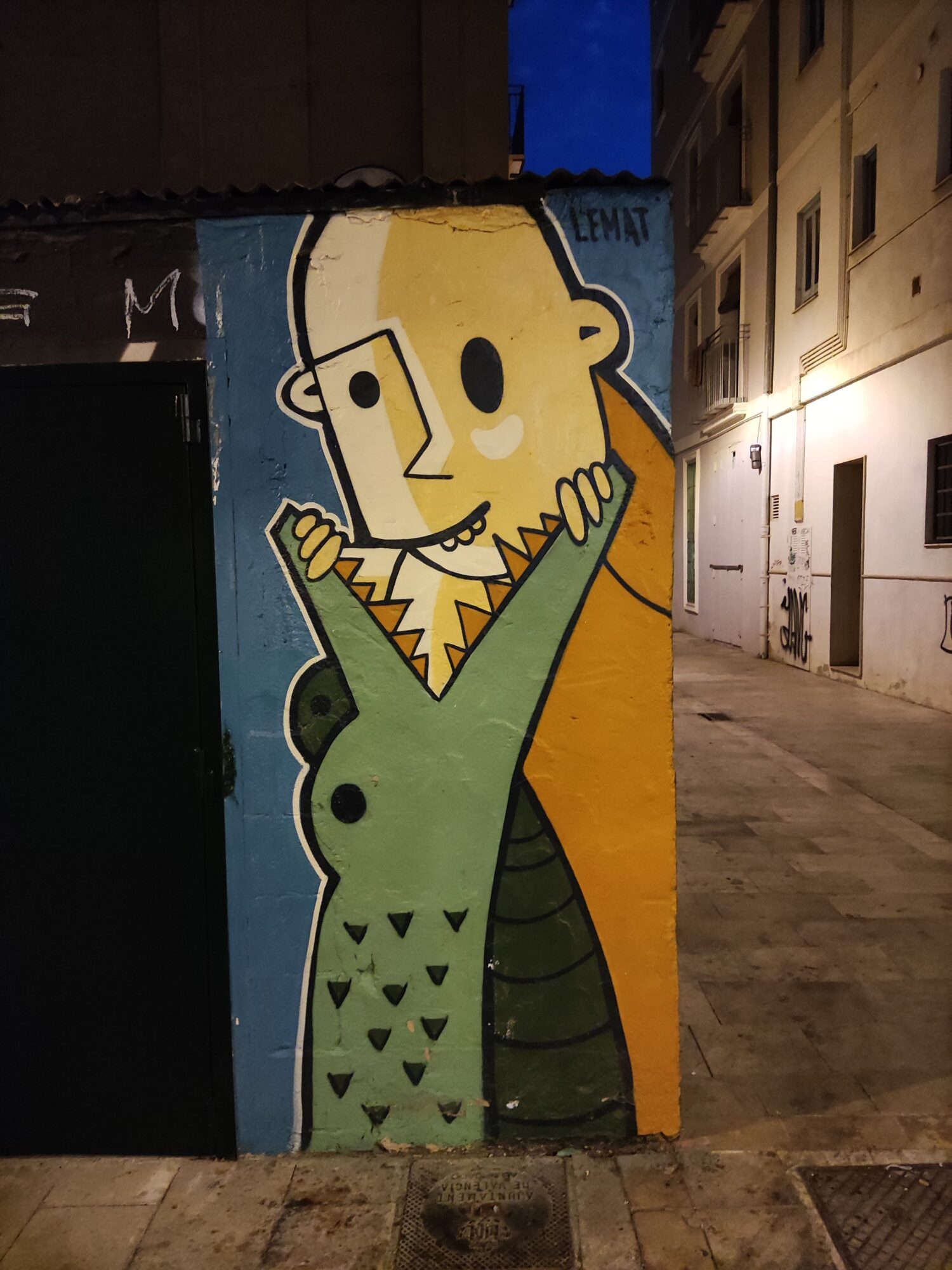 Yellow Character in a Scaled Coat — Street art by LEMAT in València