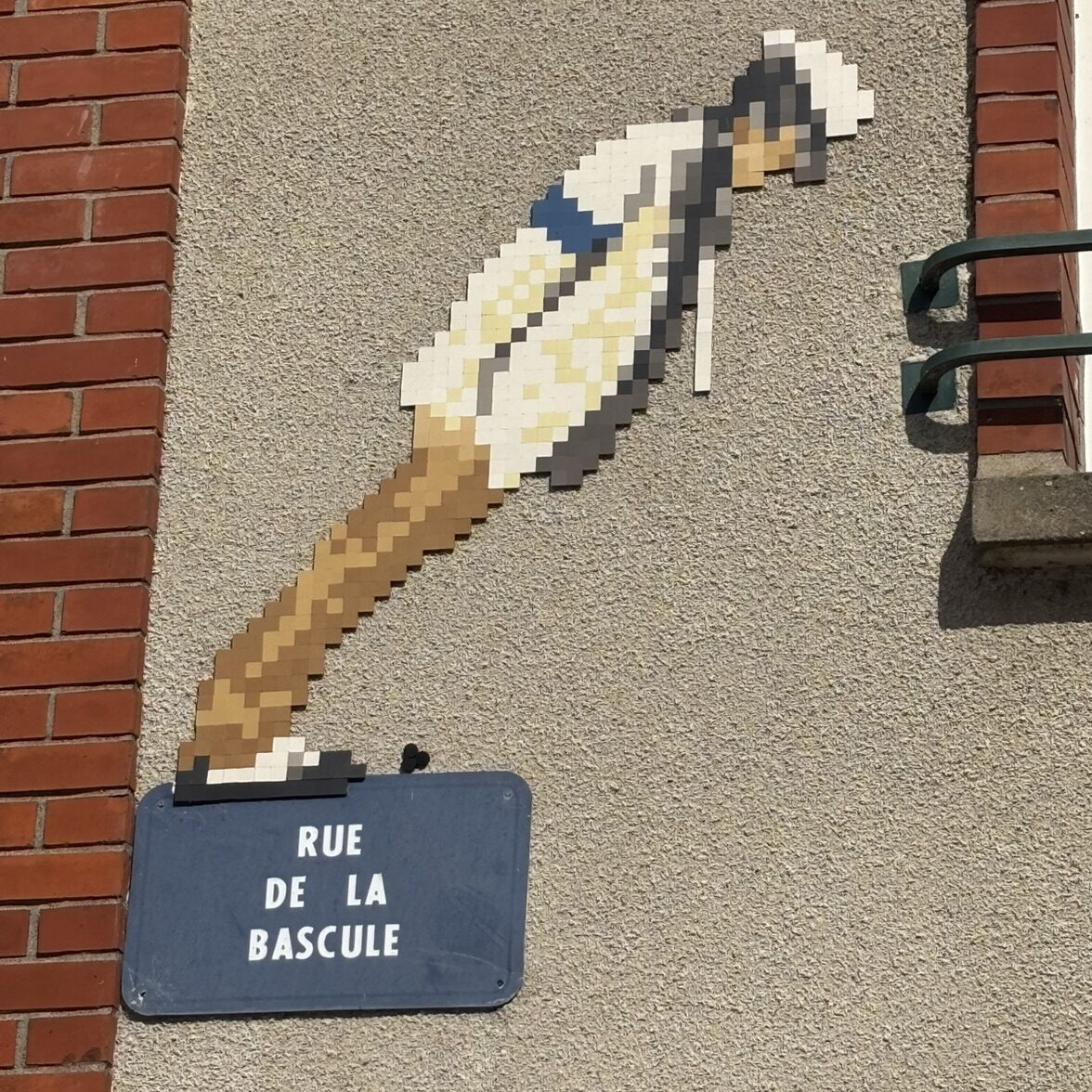 Wooden Shaft and Large White Feather — Street art by Mifamosa in Orléans