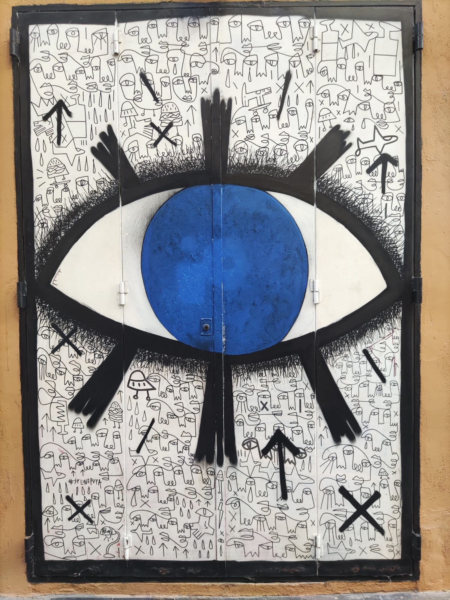 Œil bleu sur mur de gribouillis — Street art à València