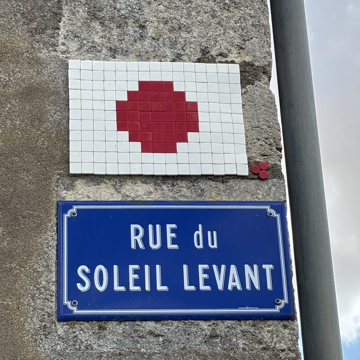The Rising-Sun Flag — Street art by Mifamosa in Outarville