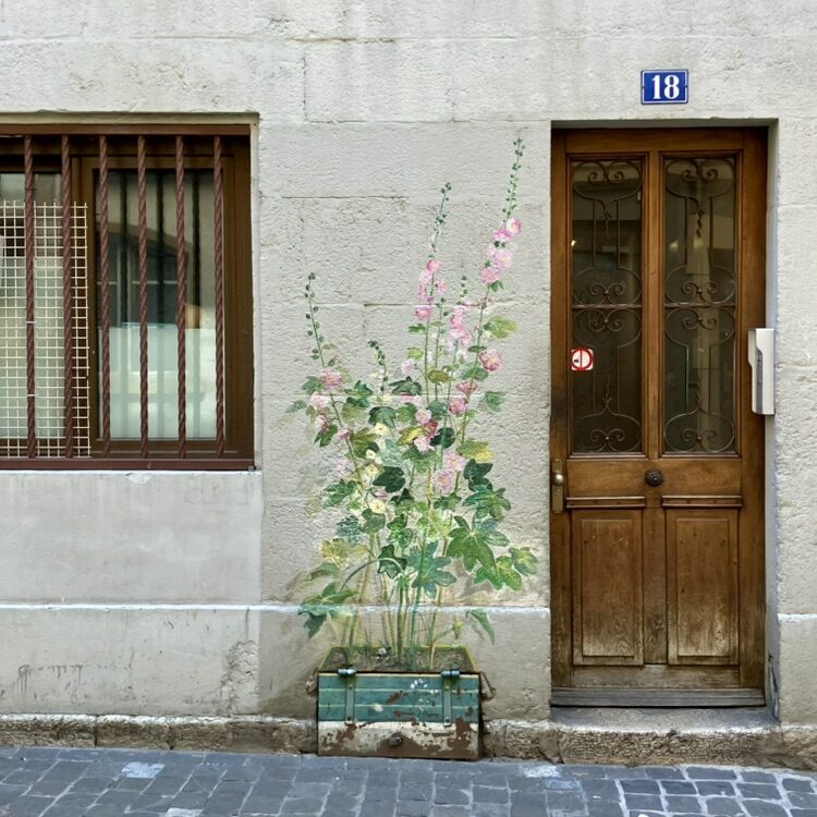 Hollyhocks at the Foot of the Wall — Street art in Neuchâtel