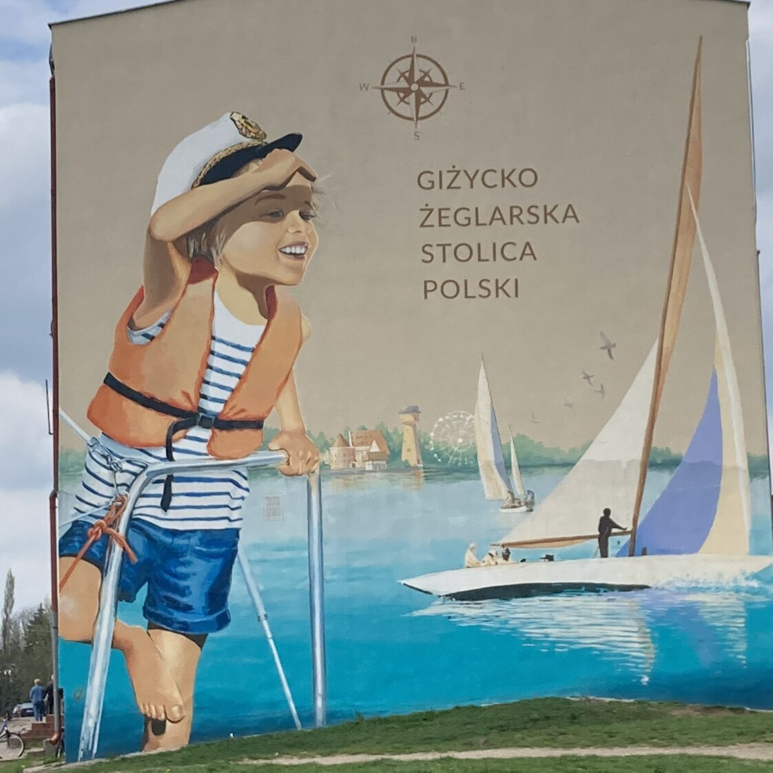Giżycki tryptyk, the sailing capital — Street art by Maria Szulc in Giżycko