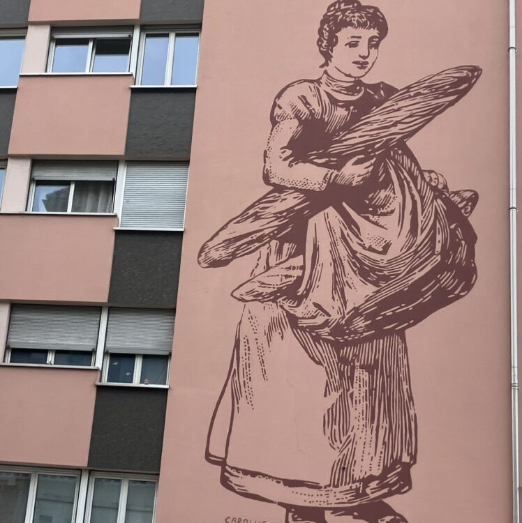 The Bread Carrier — Street art by Carolus in Le Locle