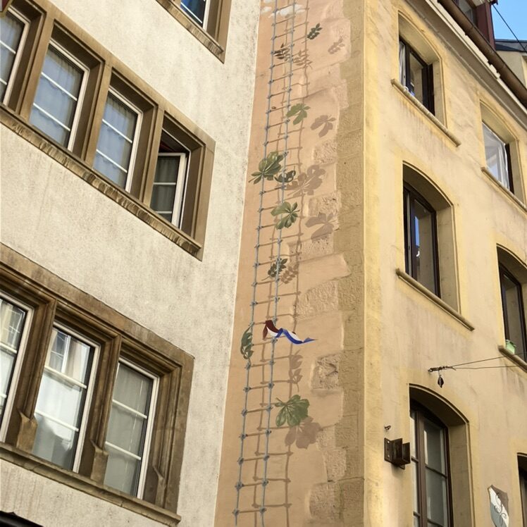Painted Trellis on the Building Corner — Street art in Neuchâtel
