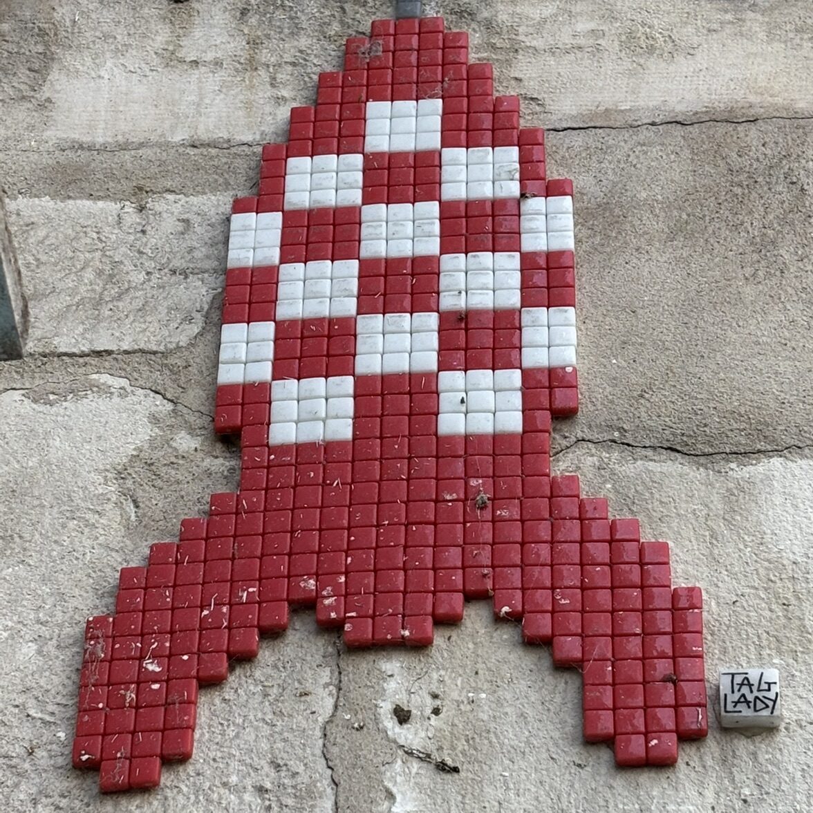 Tintin Rocket in Red Checkerboard — Street art by Tag Lady in La Rochelle