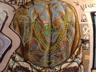 Ornate Figure Seen from Behind — Street art in Paris