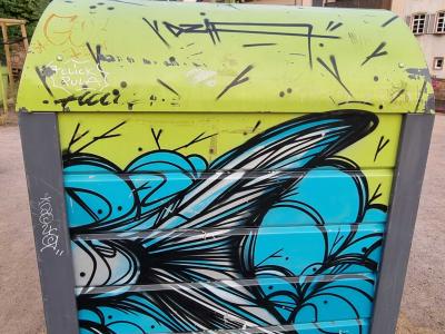 Black Wing over Cyan Clouds — Street art in Strasbourg