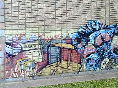 Robot and Kitchen Appliance on Tile Wall — Street art in Rīga