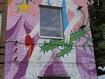 Woman with thorny branches — Street art by Egle Zvirblyte in Vilnius
