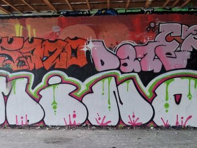 White Lettering with Pink Drips — Street art in Grenoble