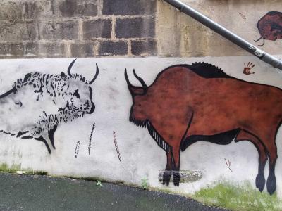 Lasco's Prehistoric Bison Face-Off — Street art by Lasco in Clermont-Ferrand