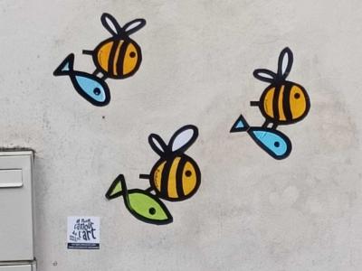 Swarm of Colorful Flying Bees — Street art by Mister Zion in Nantes