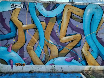 The Lettering in Blue and Gold Tubes — Street art in Vallon-Pont-d'Arc