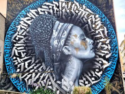 Calligraphic Medallion Profile — Street art by Snek in Grenoble