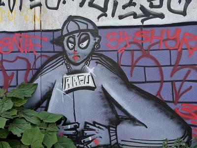 Gray Superhero with Cape — Street art in Saint-Nazaire