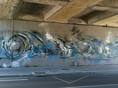 Calligraphic Waves under the Bridge — Street art in Nantes