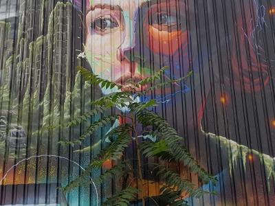 Realistic Woman Portrait with Rainbow Hues — Street art in Berlin