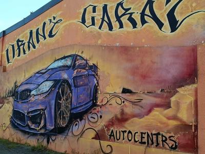 Blue Sports Car on Golden Background — Street art in Rīga