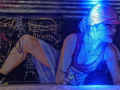 Woman in Pink Cap on Metal Shutter — Street art in Paris