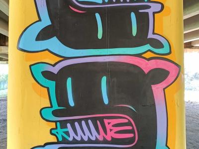 Black and Neon Abstract Graffiti on Pillar — Street art in Rīga