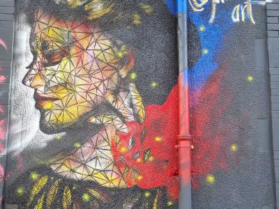 Geometric Woman Portrait — Street art by Juanw in Clermont-Ferrand