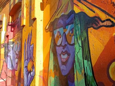 Colourful Woman Face with Glasses — Street art in Rīga