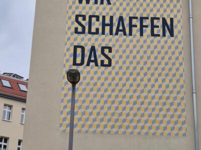 We can do it! (Wir schaffen das) — Street art in Berlin