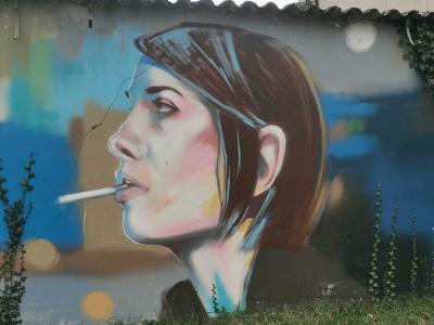 Young Girl with Cigarette — Street art by Jef in Saint-Nicolas-de-Redon