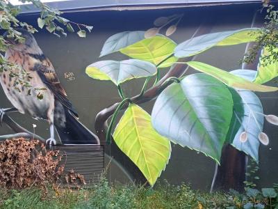 Bird with nature foliage — Street art by ART-EFX in Berlin