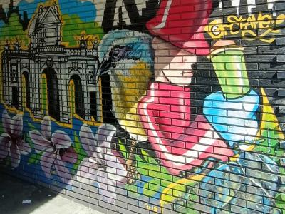 Woman in Red Before Puerta de Alcalá — Street art in Madrid