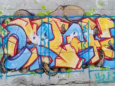 Blue and Yellow Bubble Letters Graffiti — Street art in Berlin