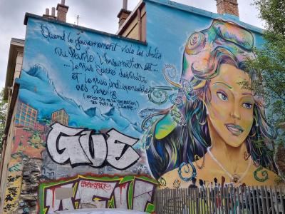 Woman Portrait and Human Rights Quote — Street art in Grenoble