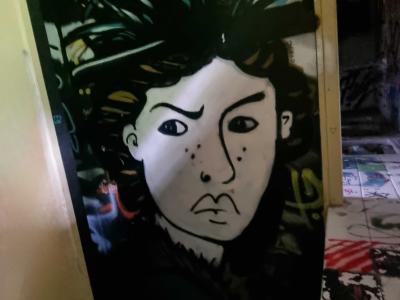 Stencilled Portrait on a Black Door — Street art in Grenoble