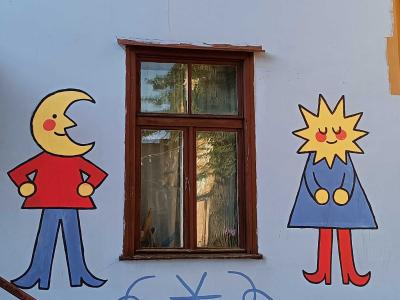 Moon and Sun as Naive Characters — Street art in Rīga