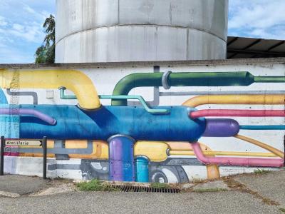 The Coloured Pipes of the Distillery — Street art in Vallon-Pont-d'Arc
