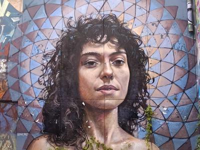 Portrait of Curly-Haired Woman, Berlin — Street art by Michel Velt in Berlin