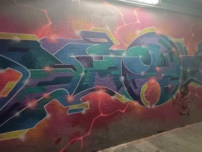 Blue and Green Wildstyle on Red Background — Street art in Prague