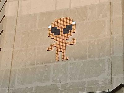 Orange Pixel Invader — Street art in Nantes